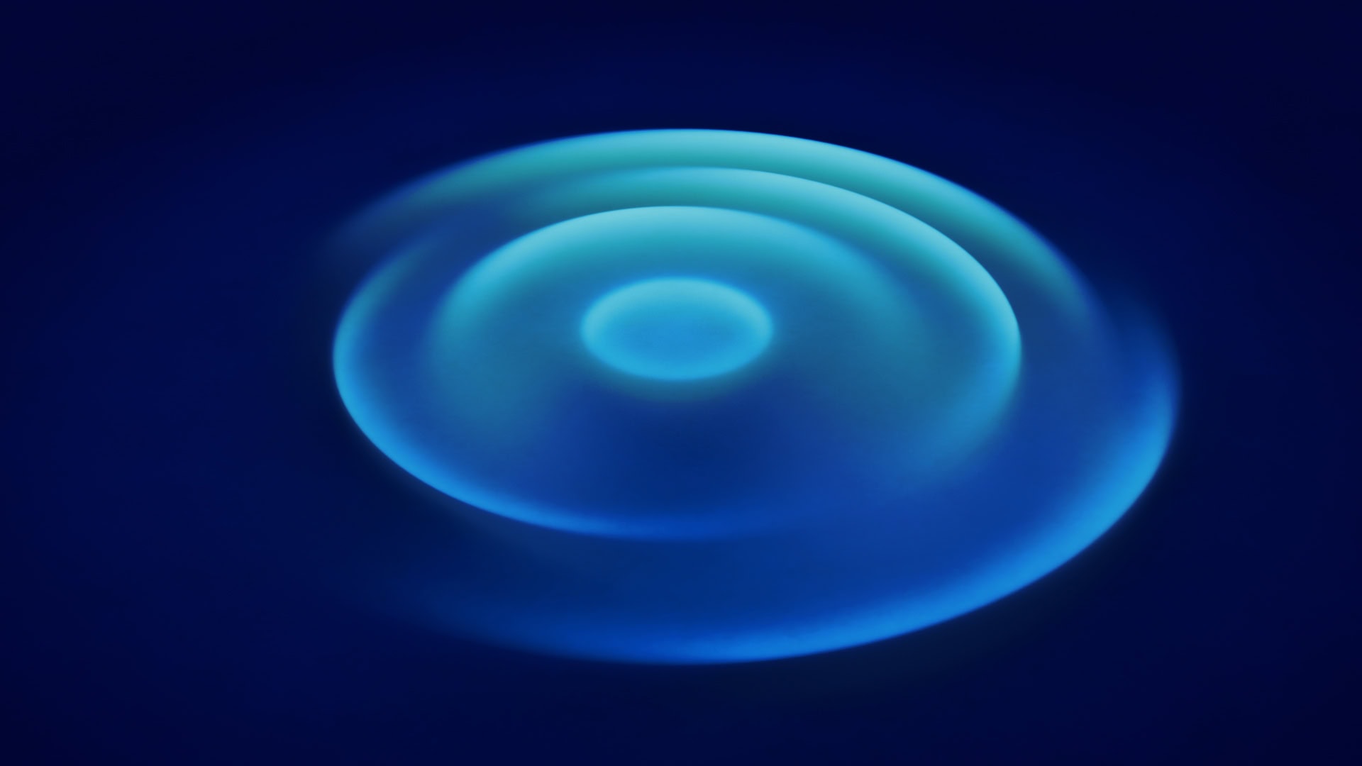 Abstract blue light pattern with concentric circles, modern digital art.